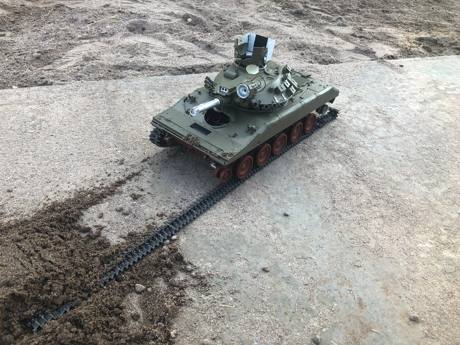 DAK Intern driving the tank around some sand castles she made and POP!