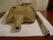 A few Porsche Turret King Tigers had the standard 2 piece barrels but a single piece 88mm gun was the most common.  The mantlet has been widened to accomadate and ETO armor barrel.