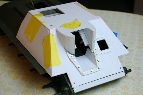 I cut the upper piece to correct the shape and bent styrene around the curve.  After bondo and sanding, I have a reasonable copy of the real thing.  Styrene was also added to the glacis and a few brass bolts complete the look.