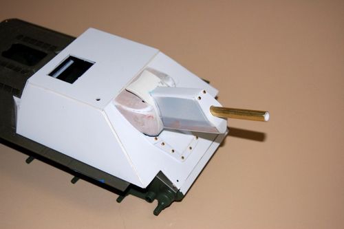 The curved rotor shield I cut from PVC.  The two are mounted together with super glue and 1-72 bolts complete the gun housing.  Vehicles often had armor added to the front of the recouperator so I will use the lower piece as a means of hiding the emitter for the contest table.