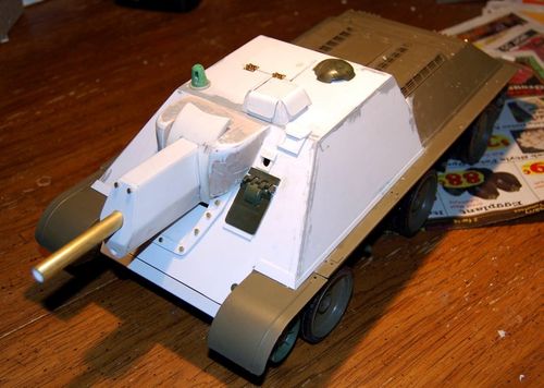 The base of the commanders periscope was fashioned from a spare 1/35 bogie wheel cut in half and I added the tensioners to the front glacis plate.  I have added the gun sights and pistol ports.  Next is tow hooks and welds.