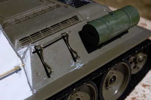 I continued the external detail with epoxy welds and I added storage racks and fuel drums.  I actually bought a T-34/85 kit for more accurate model parts.  Since I plan to trade most of it to Craig for his SU-85, we’ll say I spent $20 bucks for parts and now our project is up to $700.  Ran the kit in the yard today and it runs Great!!!!