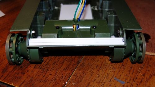 I added cross braces to the area above the drive sprockets and styrene shims to the front hull.    Beefing up the lower hull is important to the function of the drive train.