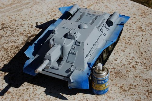 Time for details and painting.  My initial goal is to have white washed winter scheme over the normal Russian Armor Green.  I masked a few spots and sprayed on Mr Surfacer to fill in the gaps and add a rough textured surface.
