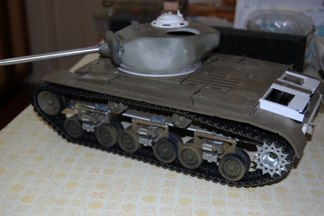 Tiff also donated a set of HVSS that lay unused from his many VVSS scratch-builds.  I bolted these in to the approximate position and test fit the track.  The next challenge is modifying the front idler as the Pershing part mounts with the first bogie assembly.  Other areas of cosmetic work include the front glacis and rear engine deck.  The T-23 had a rounded rear deck and different access hatches.