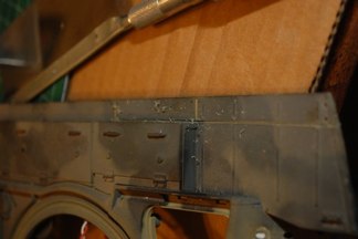 Work Begins with the removal of the excess material for the mud skirts.  Good old Razor saw does the trick.  As this was a Pershing refurb, I had to remember to remover the side skirt brackets and screws.