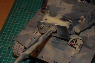 the large steel plate on the mantlet was cut from a Panther Glacis and features openings for the gun sight and Coax.