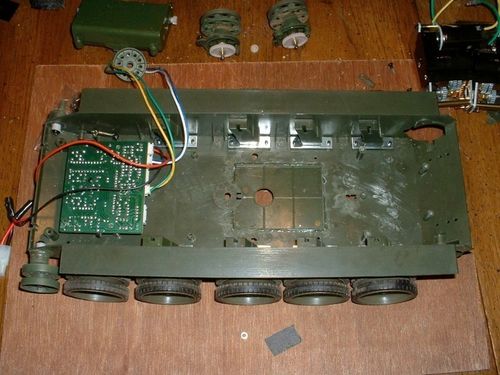 A Tamiya gearbox is here.  Until I figure out how to modify it to fit in the chassis the WSN gearboxes will do. During this process I sealed the battery hatch and sanded it flush.