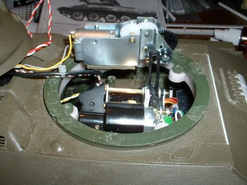 The elevation unit is placed on the turret ring with enough clearance for the recoil unit.  A slotted extension is added to the recoil unit so the barrel can elevate and depress and remain in position when firing.  This process was hard.