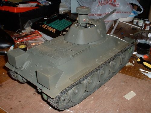 I painted a primer coat of Rustoleum camo green and let it dry all day.   Out came the styrene and voila, applique armored T34/76.  Front end now secure as well.