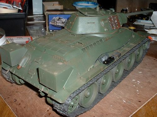 This tank is starting to look like what I imagined.  Details include; spare track, tow cable, growsers, camoflage net bag, box style external fuel tanks, some extra tools, radio antenna, and chain.