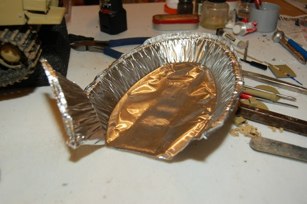 I plan to use a metal lid from Chipoltle.  The gauge was just about right and the lids are easy to find around the station.
