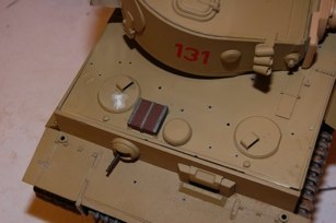 I made one hatch look like the other by filling in the periscope and then used the “K” sprue parts to make the hatches work.