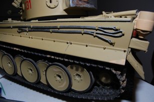 I have to actually bolt something on to my tanks and my latest effort eas the side skirts.  00-90 hex head bolts and washers were added after scraping off the originals.