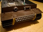 Frontal armor, hull machine gun and hinged front fenders have been base coated and are ready for abuse and weathering.