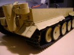 I didn't cut the fender in a straight line but created irregular and scalloped shaped cuts.  I wanted to disguise the overlap from plastic to aluminum.  Once the fenders had been undercoated and painted I attached them to the sides of the hull.