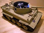 The early mantlet from the static kit has been added for an accurate Africanized Tiger. At this point, most of the guts are in, including all of the turret traverse mechanism and elevation unit. The recoil mechanism is next in line. The tank is looking like it just rolled off of the factory floor,  we'll remedy that soon enough!