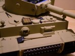 The pioneering tools are painted and have been dry fitted for placement. The tie downs and buckle detail has yet to be added, and weathering of the metal and wood should help to bring these small details out. The hull machine gun is in place wired for action.